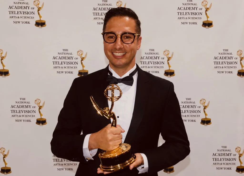 Chef David holding his Emmy award at the National Academy of Television Arts & Sciences ceremony in New York